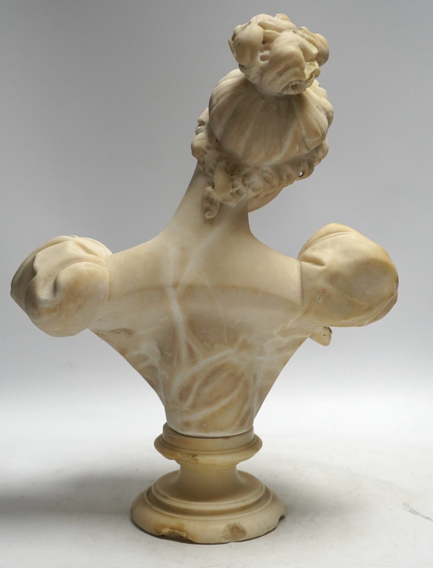 A late 19th century carved alabaster bust of a young woman, 40cm high